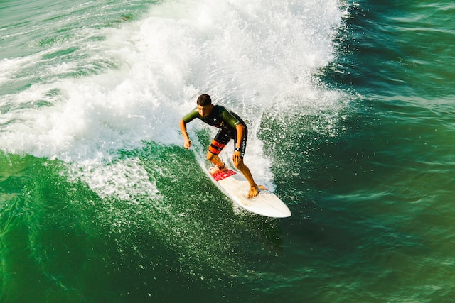 Houston outdoor activities: man on surfboard surfing against waves